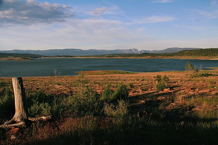Late afternoon sun settling in over Lake Heron in New Mexico with views of the mountains in the distance