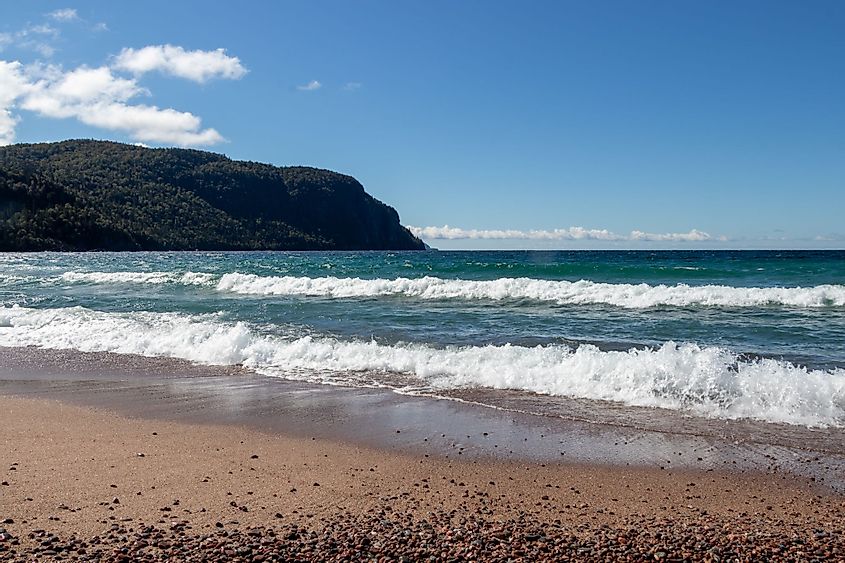 Waves on the beach at Old Woman Bay, Lake Superior Provincial Park, Ontario, Canada on a sunny day.