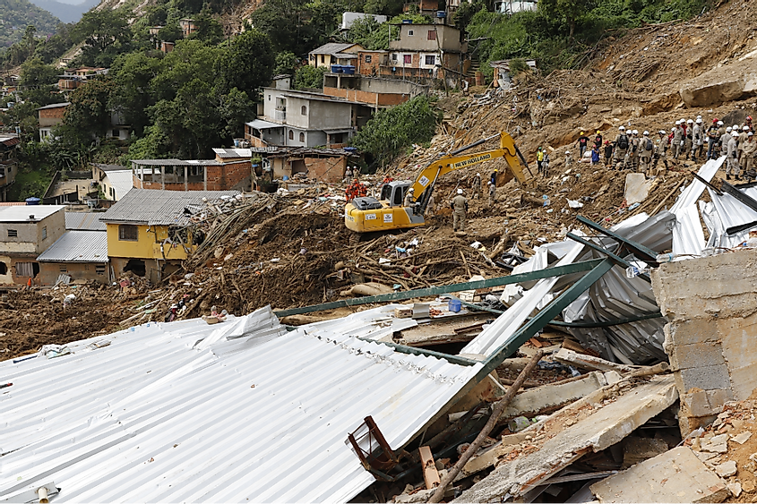 Landslide in Petropolis city, natural disaster destroyed house, mud and debris. Firefighters teams working search and rescue for victims of rain at Morro da Oficina. Rio de Janeiro, Brazil 02.25.2022