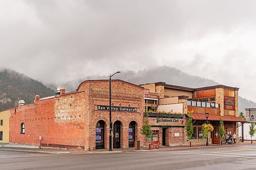 Street scene in historic downtown Ketchum, Idaho, with brick buildings, boutique shops, and restaurants