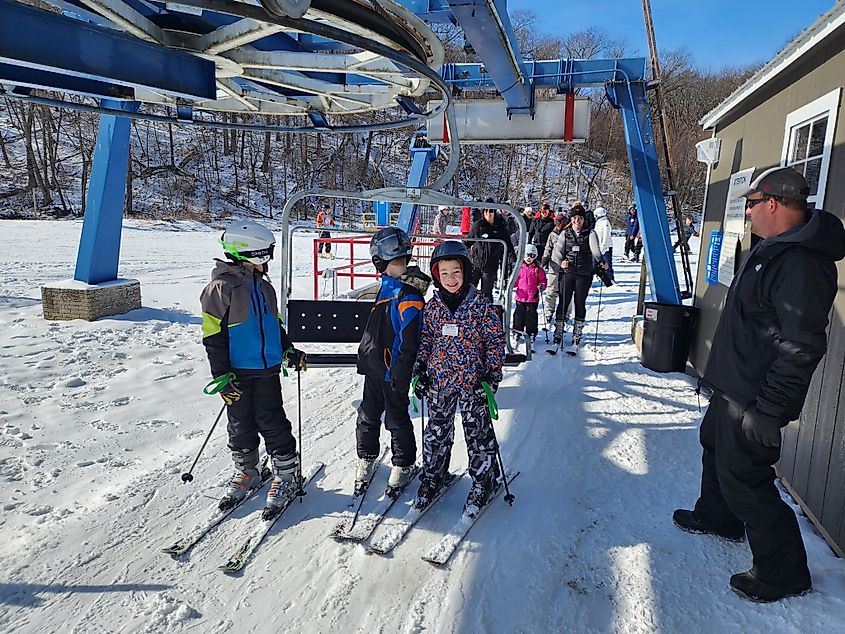 Skiers at Snowstar Ski Resort in Andalusia, Illinois. Editorial Credit: Snowstar Ski Resort Facebook page.