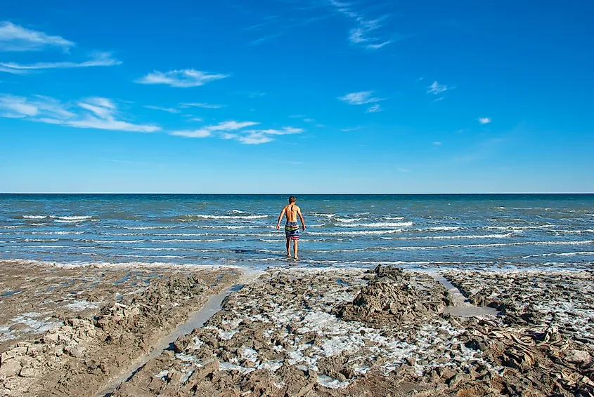 Person standing in the Aral Sea.