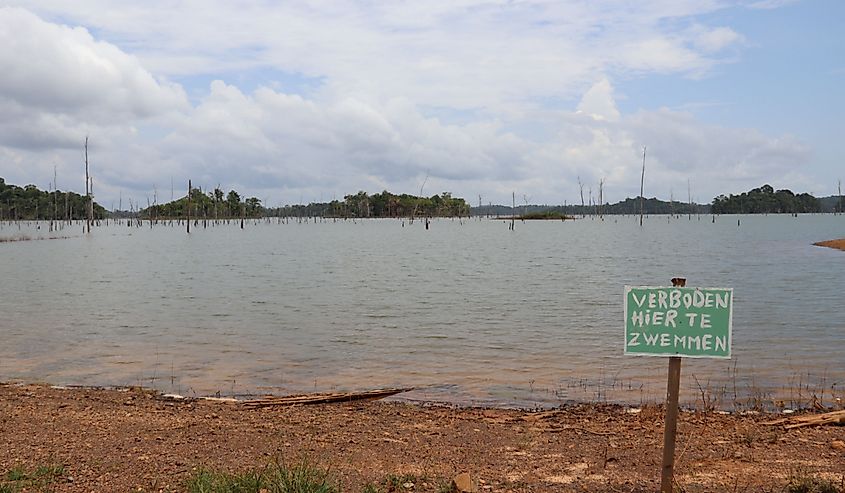 Brokopondo Reservoir. Lot's of Piranha's swim here. Translation: Forbidden to swim.