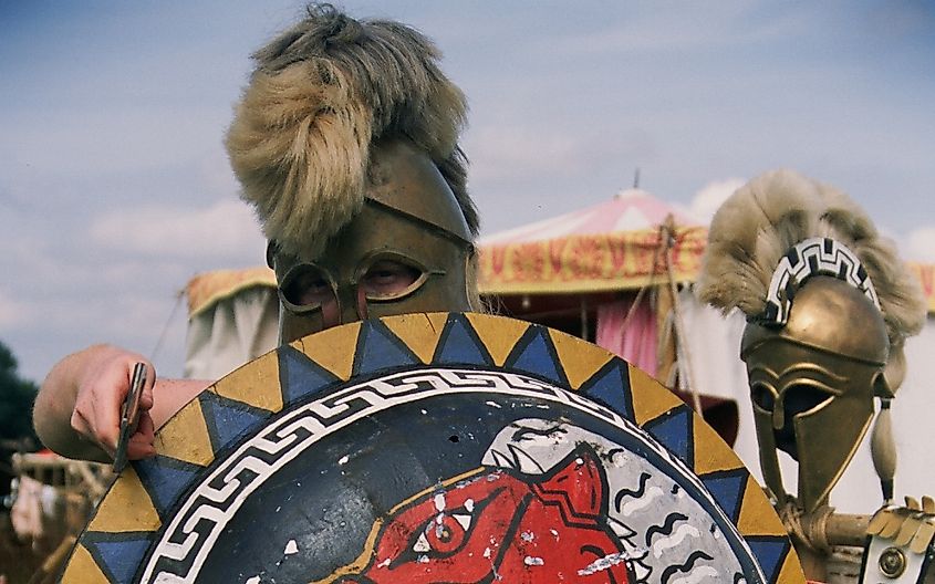 a re-enactor of the Hoplite Association wearing a Greek Hoplite costume,helmet, sword and shield from the 480BC period 