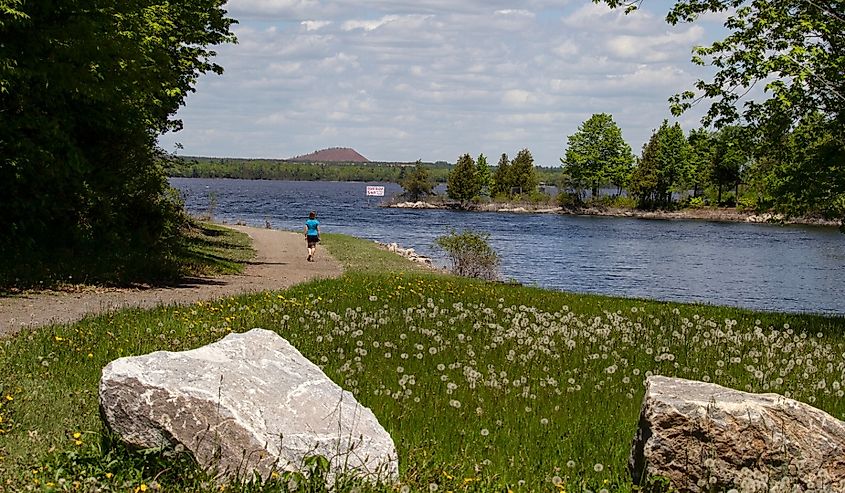 Taking a walk down a town path beside the Madawaska River where it empties into the Ottawa River in Arnprior, Ontario, Canada.
