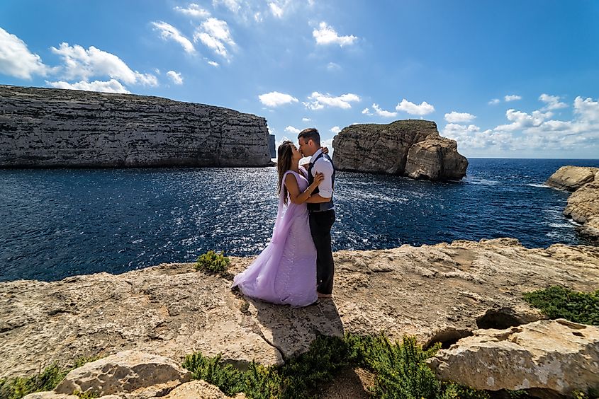 Wedding photography - Couple getting married on the rugged Maltese coastline. Island of Gozo, Malta.