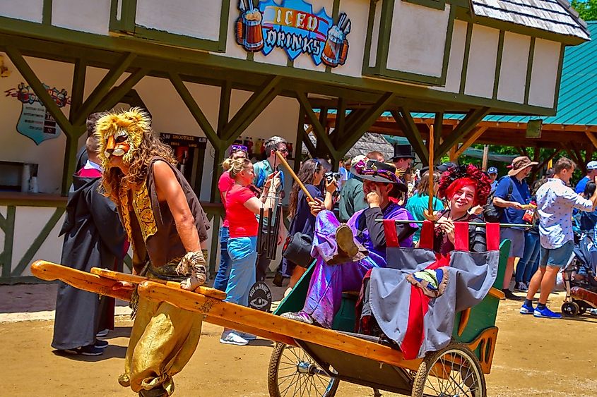 People dressed in colorful costumes at the Scarborough Renaissance Festival Grande Parade in Waxahachie, Texas