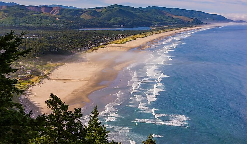 Aerial of Manzanita Beach and Pacific Ocean surf on Oregon coast