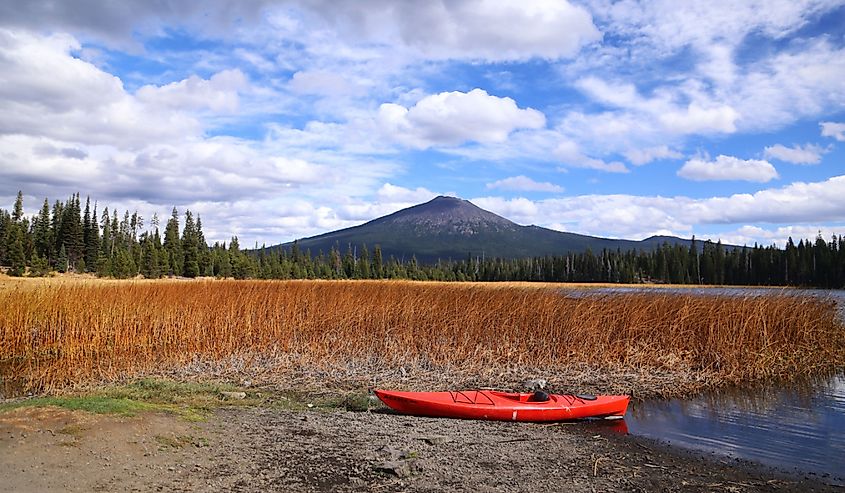 A red kayak is seen on the boat launch of Central Oregon's Hosmer Lake with Mt. Bachelor in view 
