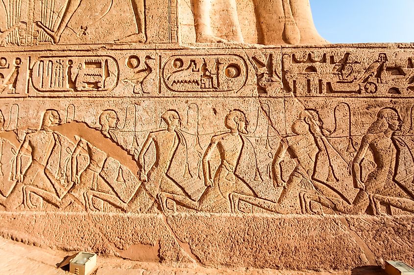 Egyptian relief of defeated and enslaved enemies at the temple of Abu Simbel, Egypt.