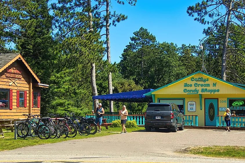 St. Germain, Wisconsin: Summer view of cyclists and their bikes between ice cream and coffee shops