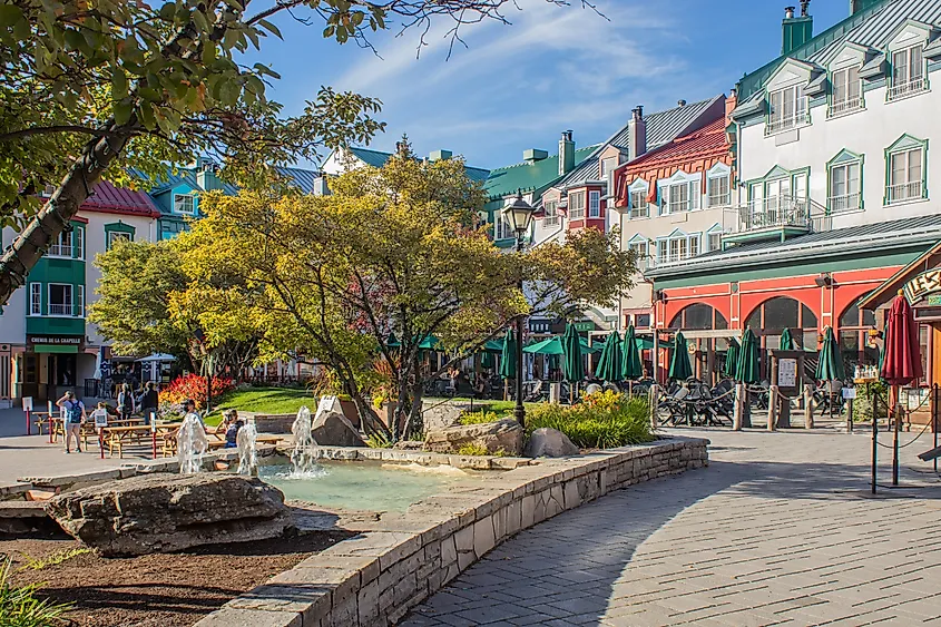 Plaza Scene in Mont-Tremblant Village with Fountain and Buildings.