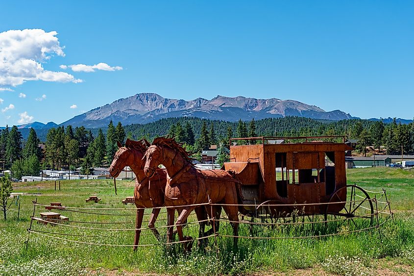 Rusty Metal horse and wagon sculpture behind the Colorado Midland Railway Depot in Woodland Park. Editorial credit: Rosemarie Mosteller / Shutterstock.com