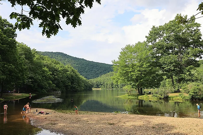 Children at play along the bank of the lower lake at Sherando Lake Family Campground, via Anne Katherine Jones / Shutterstock.com