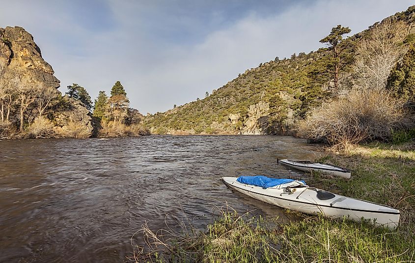 Canoes along the banks of the North Platte River near Saratoga, Wyoming.