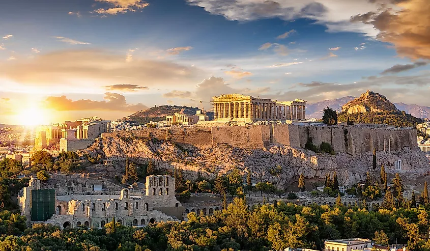The Acropolis of Athens, Greece, with the Parthenon Temple on top of the hill during a summer sunset.