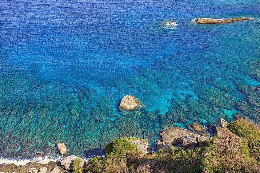 A beautiful blue tropical ocean converging with a shallow reef in Saipan Island.