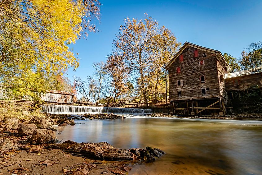Historic mill and covered bridge on Talladega Creek at Kymulga Grist Mill and Park, via JNix / Shutterstock.com
