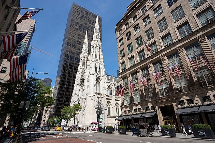 Street scene on the 5th Avenue in Midtown Manhattan, New York City, on the Fourth of July. St. Patrick's Cathedral is seen in the background, via Tada Images / Shutterstock.com