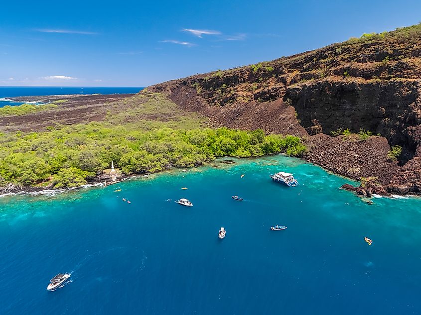 Aerial view of the Captain James Cook Monument in Kealakekua Bay, Big Island, Hawaii, marking his death in a confrontation with native Kānaka Maoli.