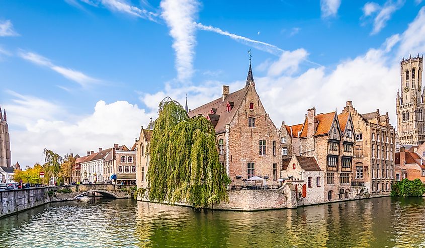 Panoramic city view with Belfry tower and famous canal in Bruges, Belgium.