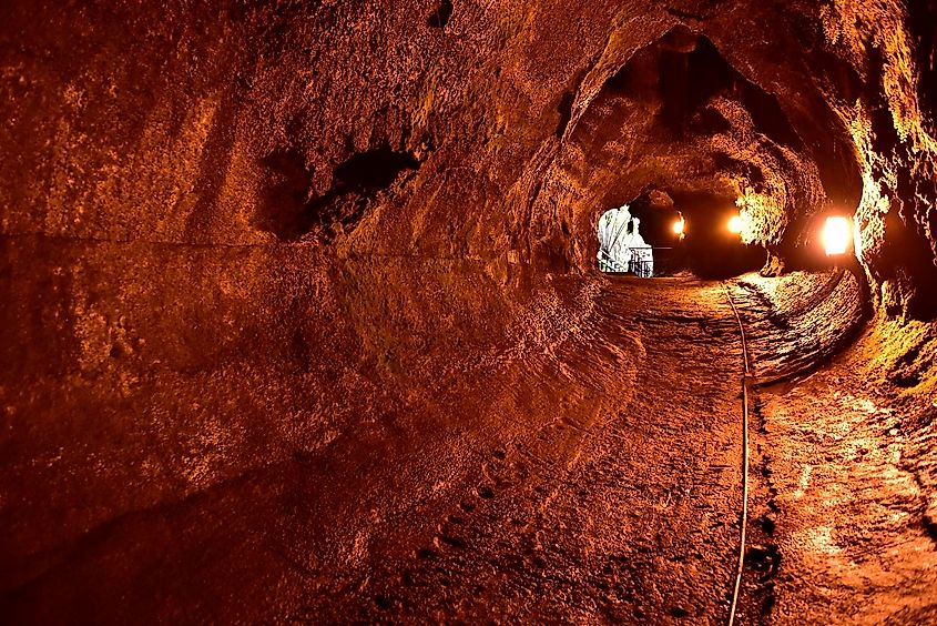 Entrance to the Thurston Nāhuku Lava Tube surrounded by lush tropical vegetation in Hawaiʻi Volcanoes National Park