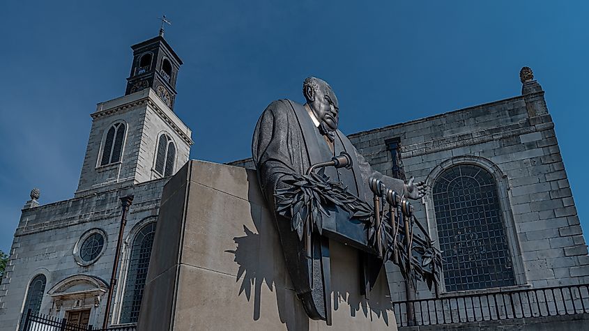 Bronze statue by Don Weigand stands in front of church at Westminster College that serves as National Winston Churchill Museum in Fulton.