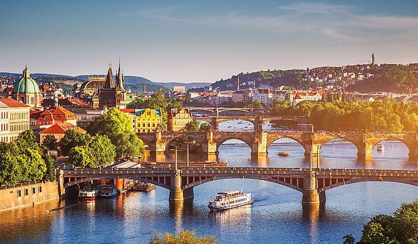 Scenic spring sunset aerial view of the Old Town pier architecture and Charles Bridge over Vltava river in Prague, Czech Republic