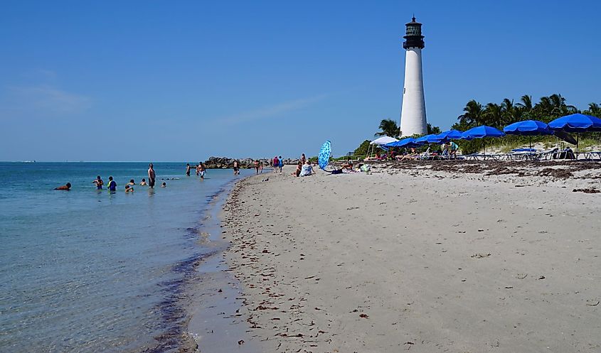 View of the beach and Cape Florida Lighthouse in the Bill Baggs State Park in Key Biscayne, Florida