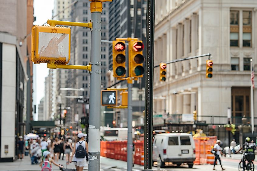 Multiple traffic lights and pedestrian crossing signals. 