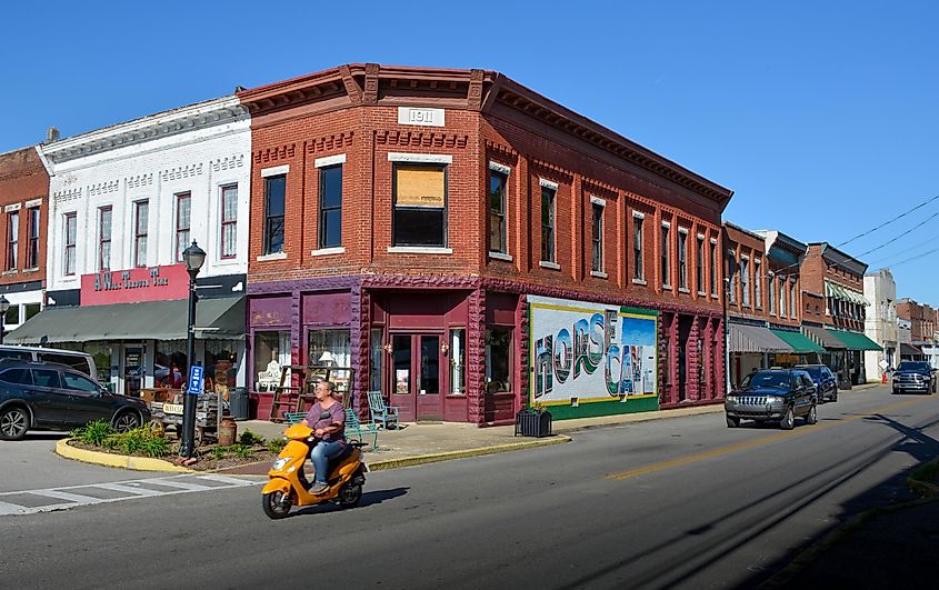 An orange scooter passes by the historic main street in Horse Cave, Kentucky, via Robin Zeigler / Shutterstock.com