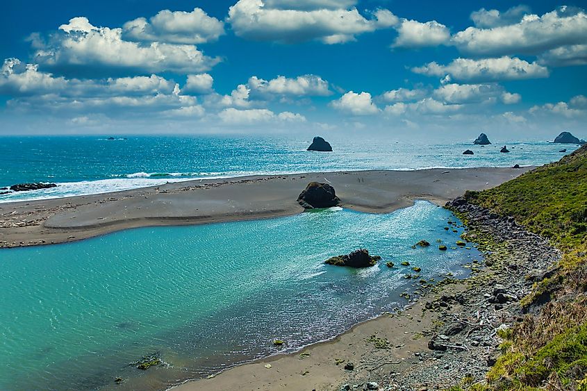 Rocks and beach of Russian River empying into Pacific Ocean at Jenner, California