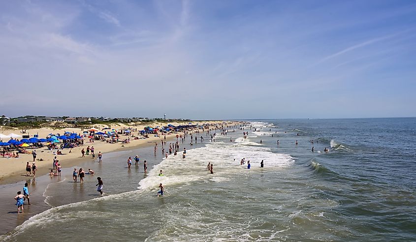 People enjoying a day at the beach on the Atlantic Ocean in Tybee Island, Georgia