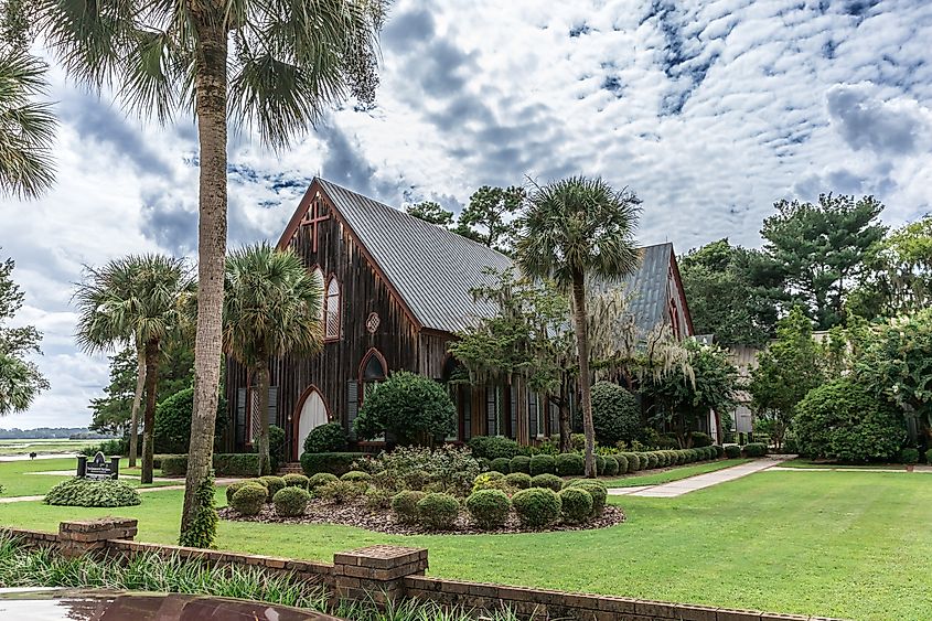 The historic Church of the Cross in Bluffton, South Carolina, during the day.