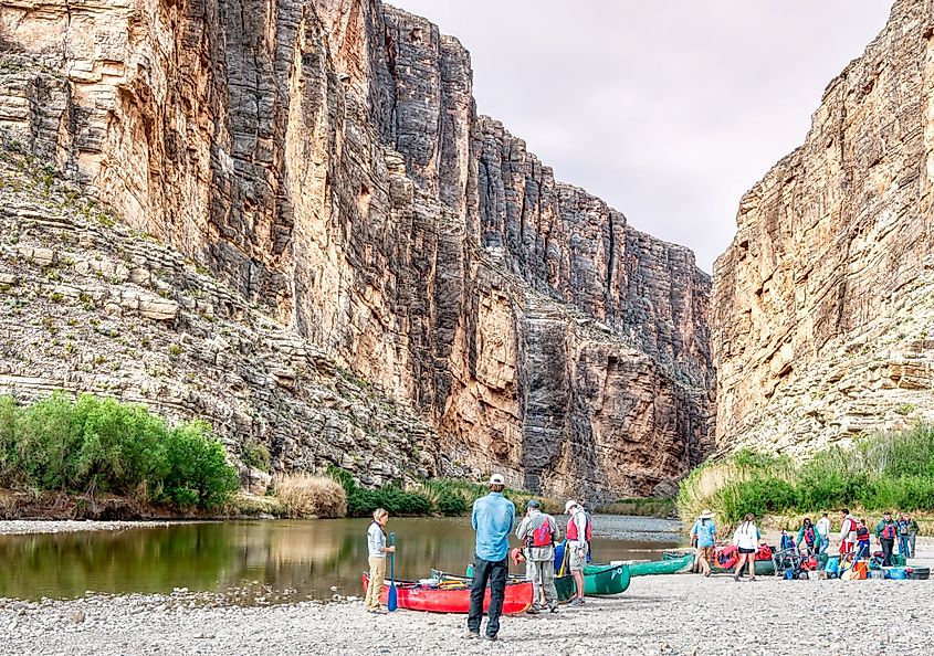 Canoeists prepare to paddle down the Rio Grande River through Santa Elena Canyon in Big Bend, Texas.