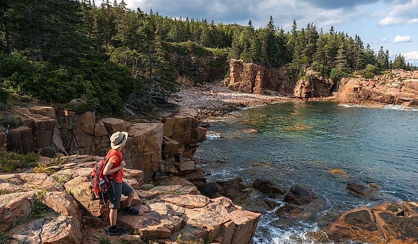 hiker taking in the views in Acadia National Park