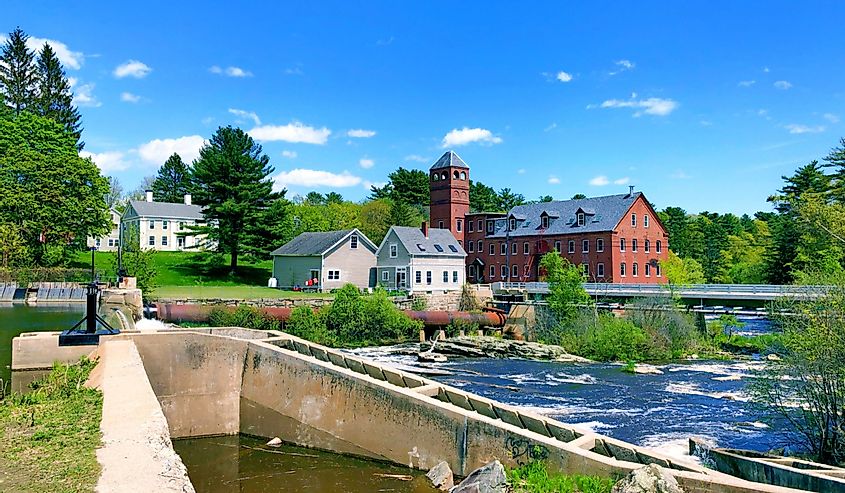 Sparhawk Mill, formerly a cotton mill house exterior by Bridge Street Dam in Yarmouth, Maine.