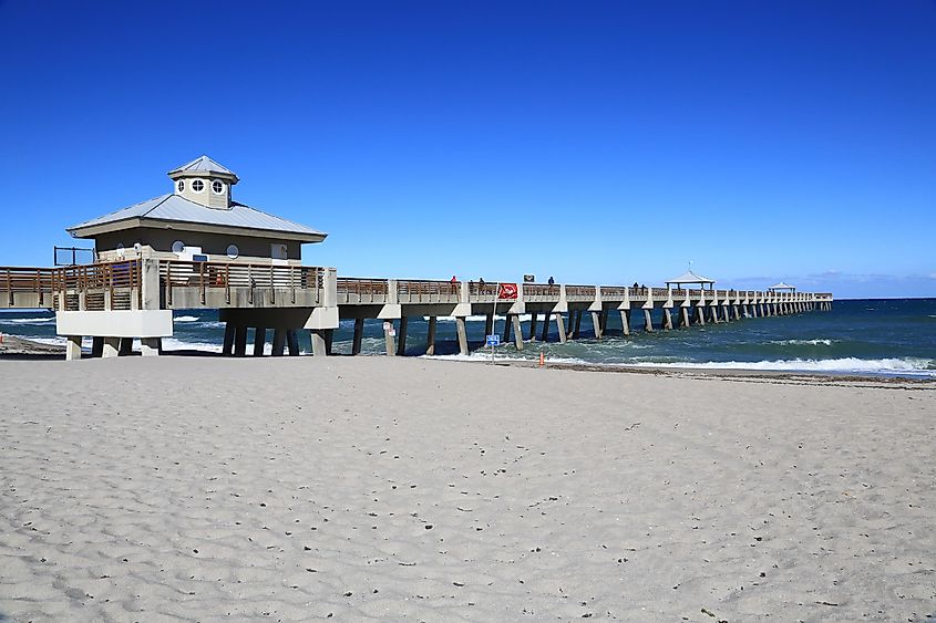 The Juno Beach fishing pier along the beach in Juno Beach, Florida.