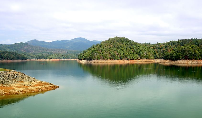 Located near Murphy, North Carolina a beautiful landscape photo showing a lake and mountains.