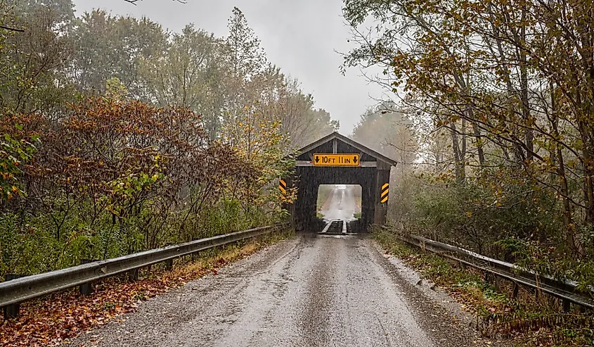 The Harrington Covered Bridge crosses the West Branch of Conneaut Creek during the Autumn leaf color change in Erie County, Pennsylvania.