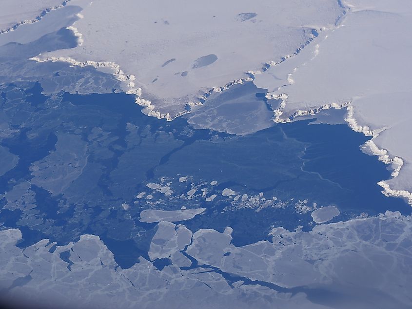Aerial winter view of Bering Sea frozen and covered in ice chunks, seen from an airplane