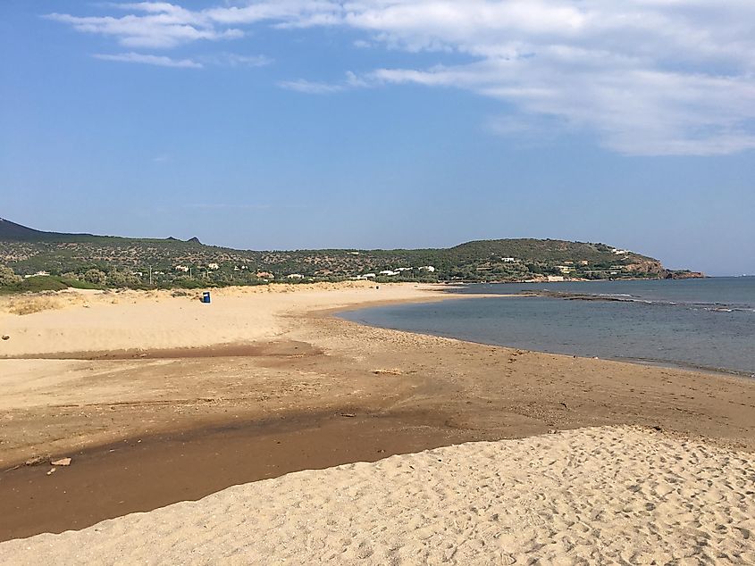 A long, wild beach with no people or infrastructure in sight. 