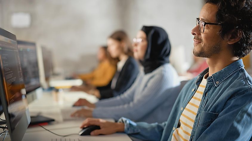 A group of people using computers to learn new things