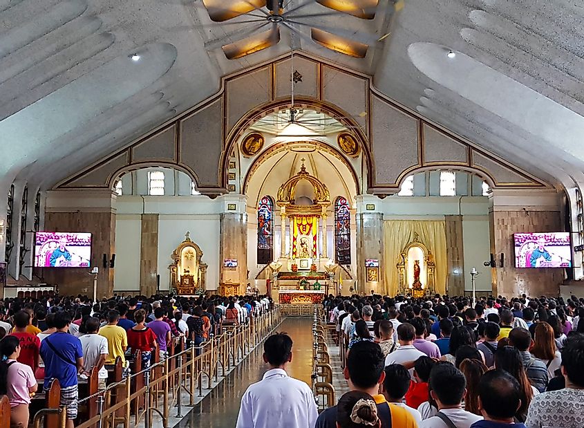  Interior of the famous Catholic Church named Quiapo Church, that have a lot of Christian people praying for holy mass in Sunday.