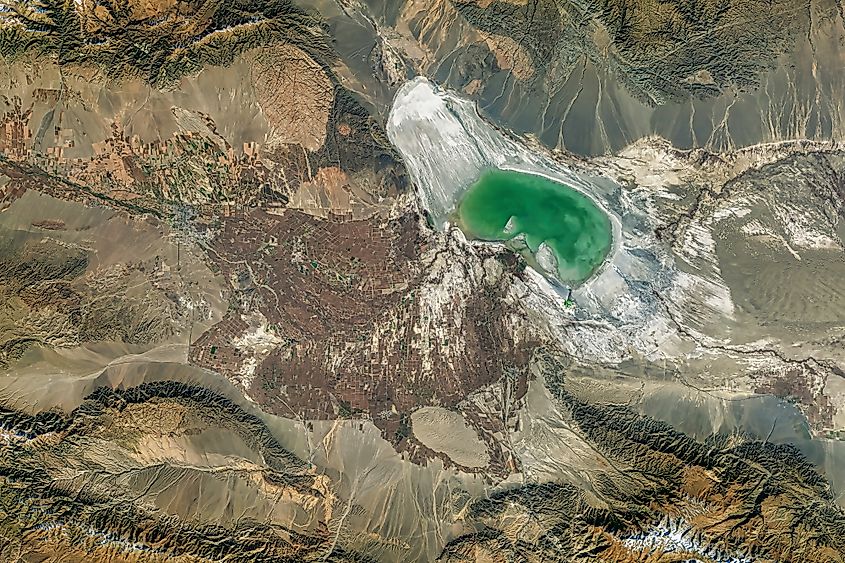 Shrinking Lake Ebinur in northwestern China with exposed saline flats, highlighting water loss and increased risk of dust storms.