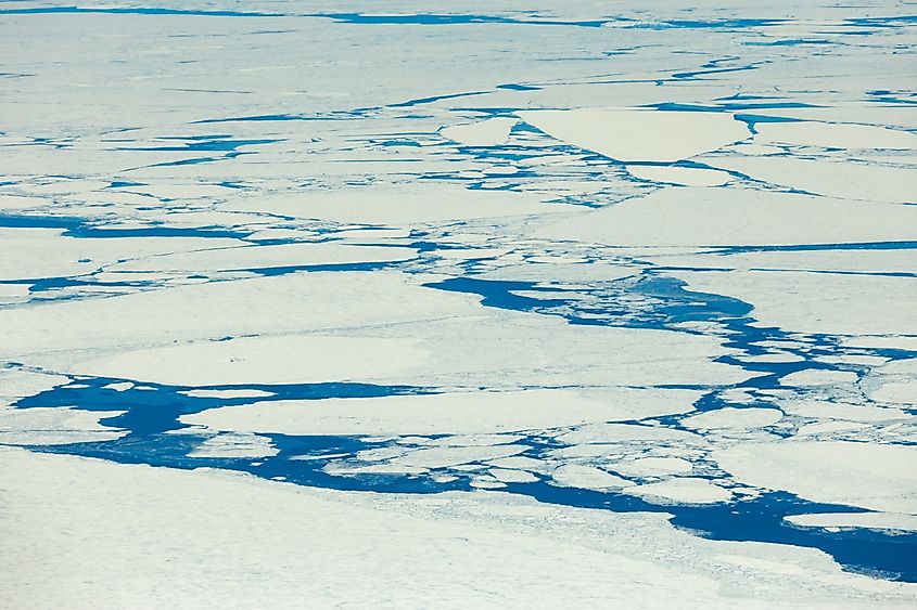 Aerial view of Antarctic Ocean with ice sheets.