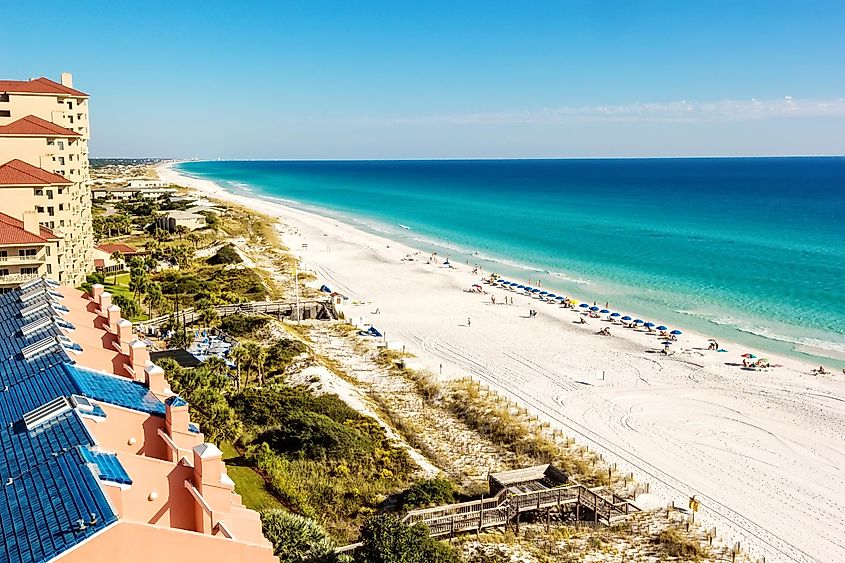 Miramar Beach stretch in Destin, Florida, with emerald green Gulf waters.