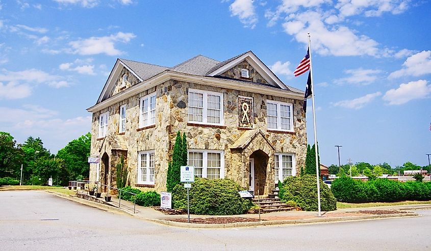 Old Rock House in Walhalla, South Carolina with a flag out front.