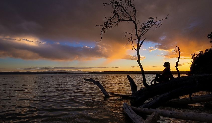 Woman in the sunset at Camano Island State Park.