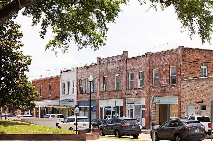 Editorial Photo Credit: Matt Gush via Shutterstock. Marksville, Louisiana, USA - April 25, 2024: Afternoon traffic on Main Street through the historic downtown core.